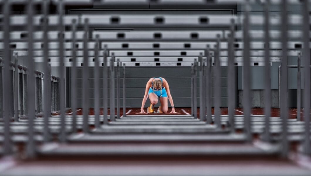 Germany, Baden Wurttemberg, Winterbach, Female hurdler right before sprint