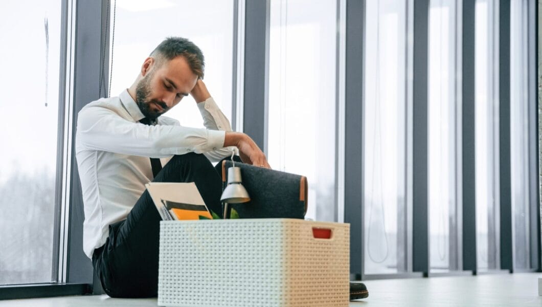 Unemployed man is with personal belongings after being fired
